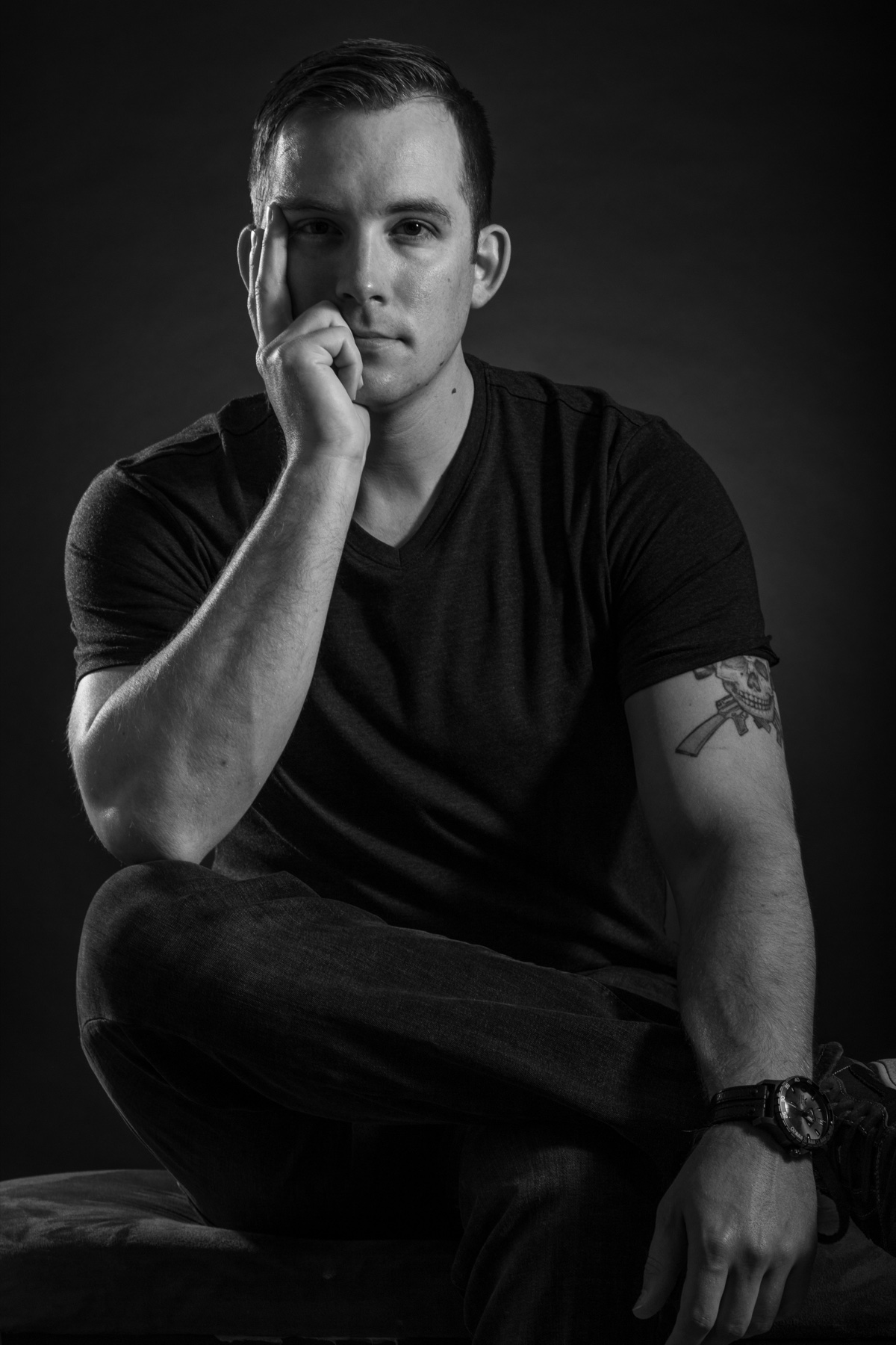 Chris Cooley — black-and-white editorial portrait, seated, contemplative.