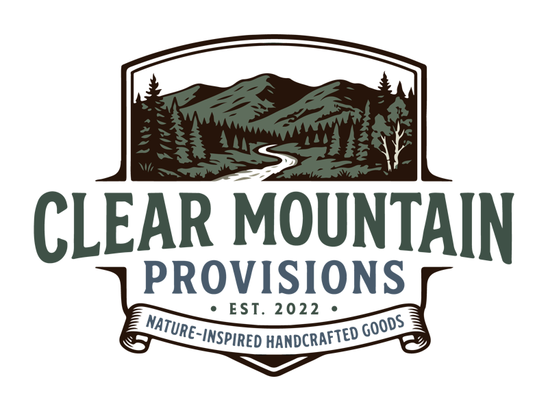 Clear Mountain Provisions logo — a vintage outdoor badge with a forested mountain illustration.